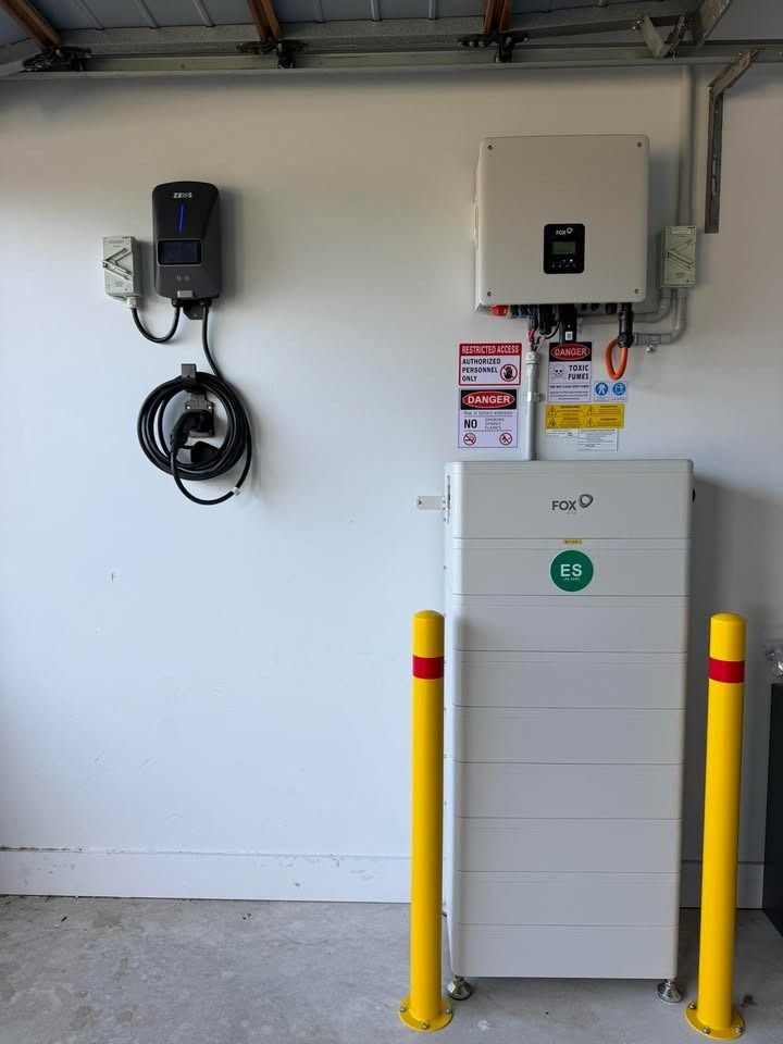 Fox ESS battery stack, hybrid inverter and EV charger installed in a garage